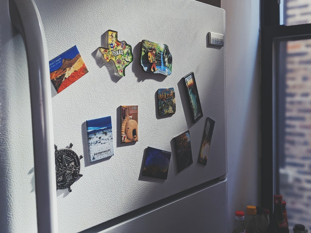 gray-top-mount-refrigerator-with-stickers-rqeeq4uf6jo